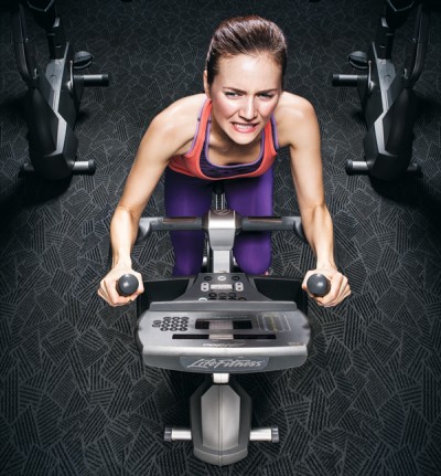 a woman on an exercise bike